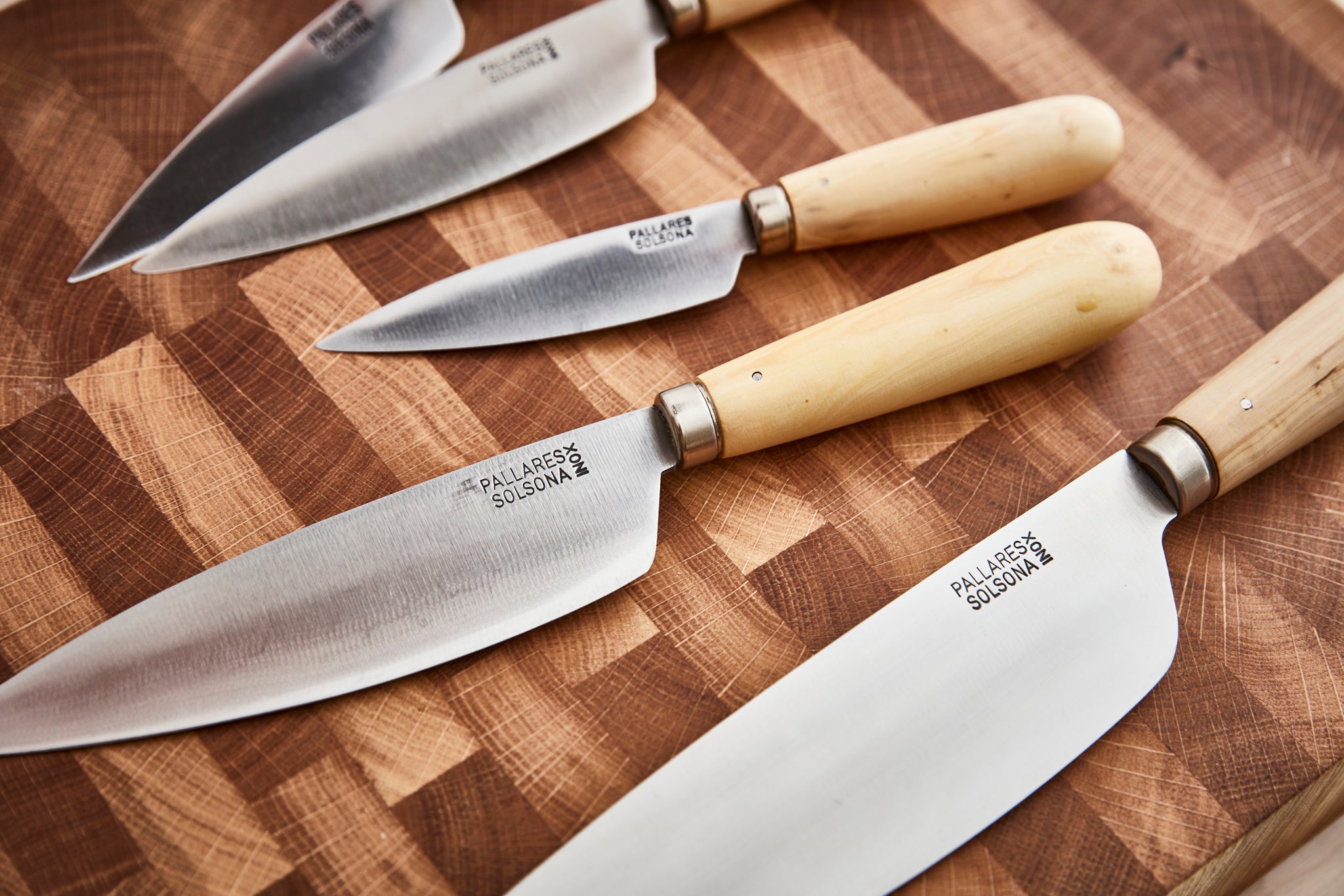 Spanish Pallares Solsona kitchen knives with long curved cutting edge and boxwood handles