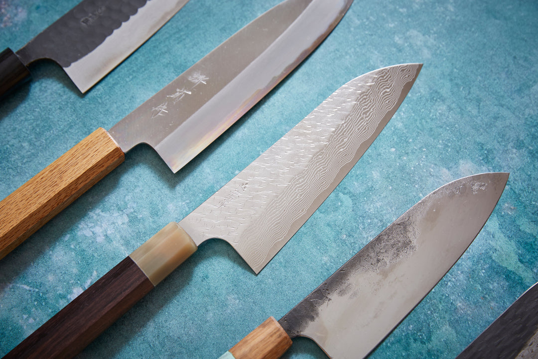 5 handmade japanese santokus with a hammered or blackened finish, the japanese all round kitchen knife 