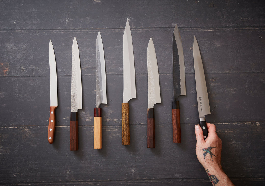 Photo of a row of handmade japanese carving knives 